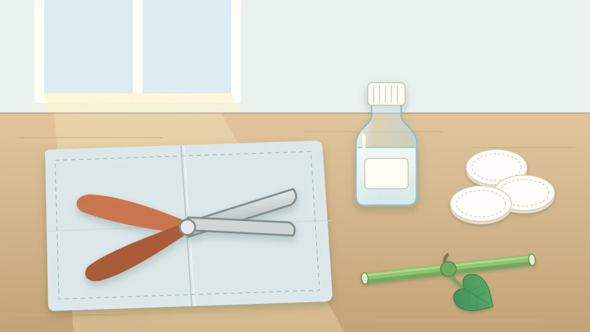 Open bypass pruning snips resting on a folded cloth beside a small bottle of clear liquid, cotton pads and a cleanly cut stem piece
